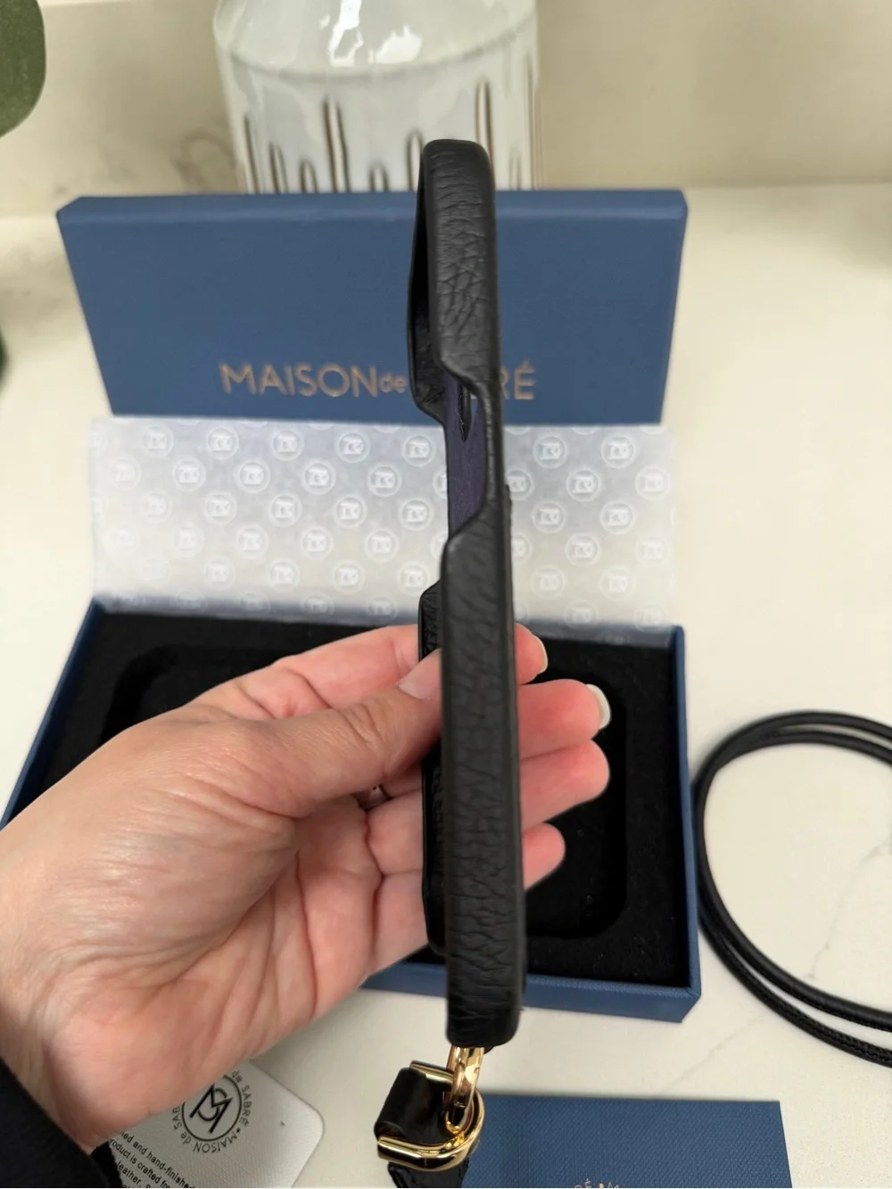 Maison de Sabre Sling Phone Case iPhone 14 Pro in Black Caviar and Gold Hardware